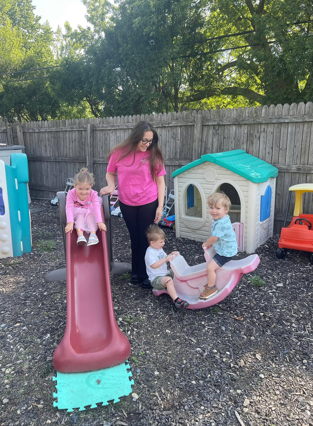 Apple Jacks caregiver playing with children outdoors